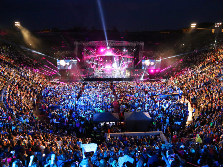 Live concert inside the Arena with people and stage.